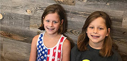 Two young girls with phase 1 orthodontics