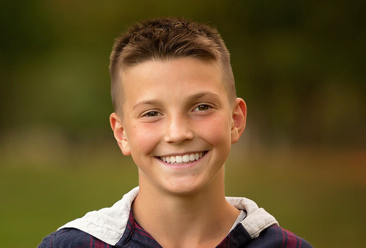 Boy with healthy straightened teeth