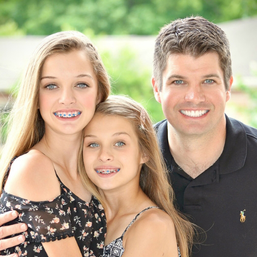 Dr Wigal with his two daughters