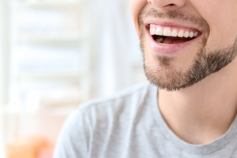 https://www.wigalorthodontics.com/blog/wp-content/uploads/2021/02/Closeup_of_man_with_straight_teeth_smiling__.jpg